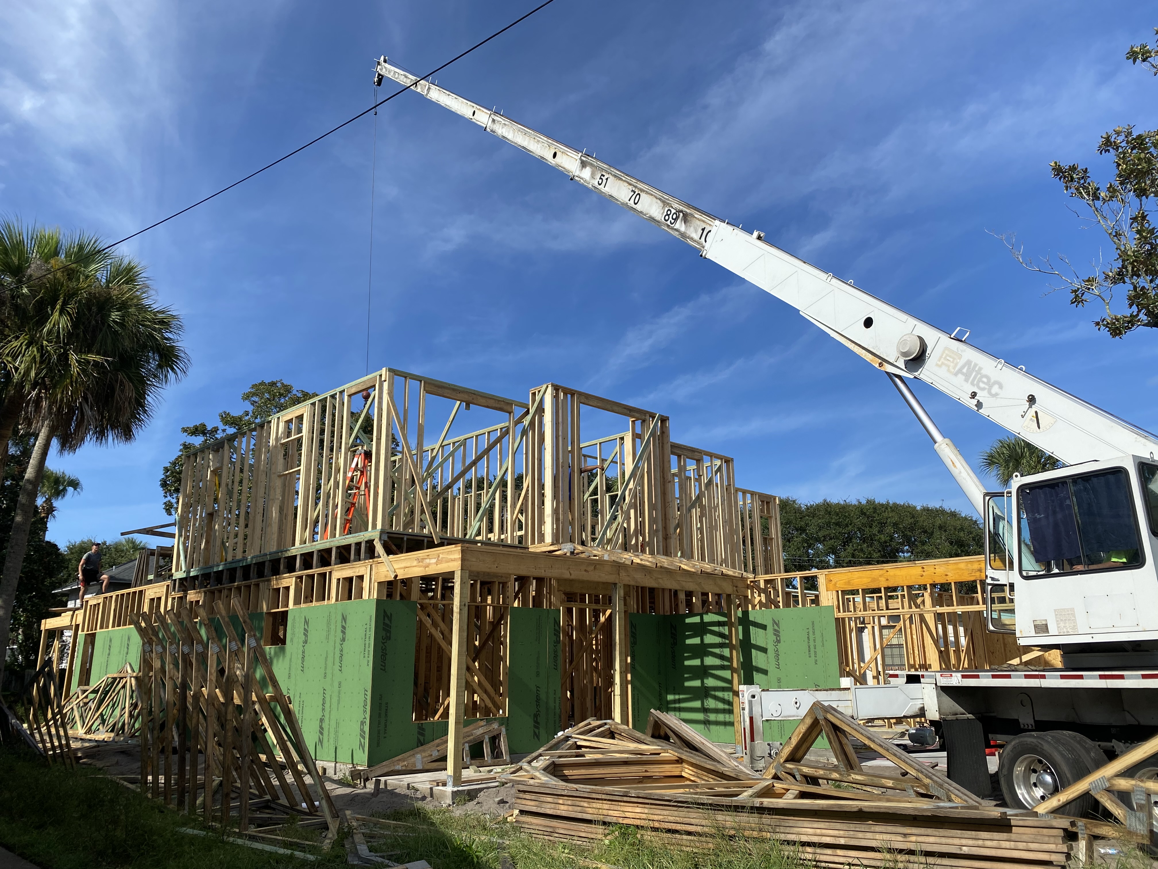 New home framing with crane — Coastal Living Construction