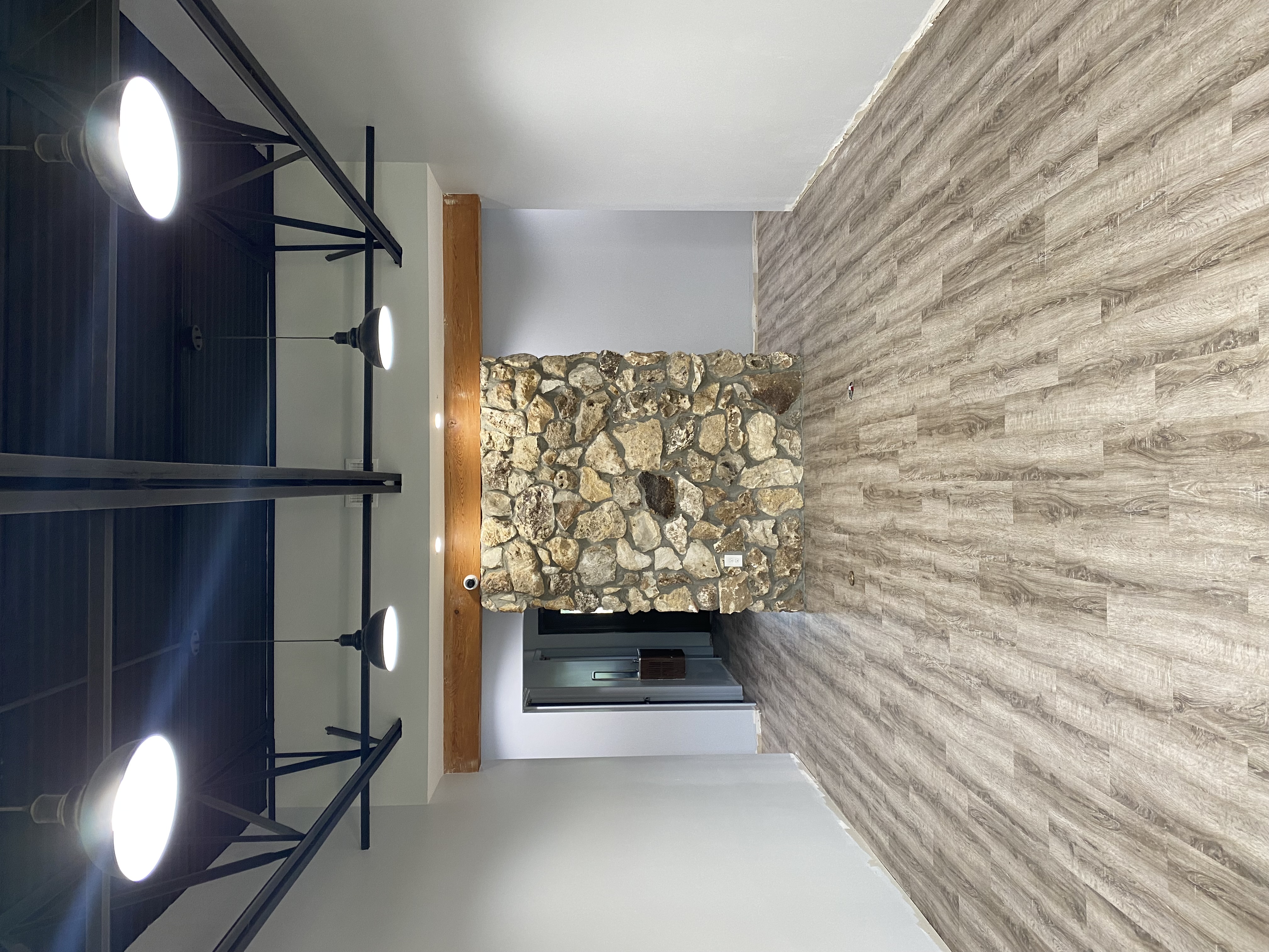 Commercial remodel with custom stone fireplace in Northeast Florida by Coastal Living Construction